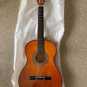 BCP guitar with case, strap, tuner and pick.